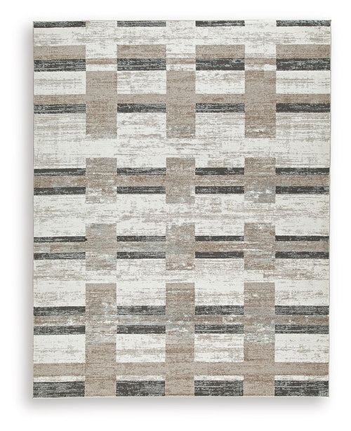 Beige abstract block pattern area rug with dark gray accents