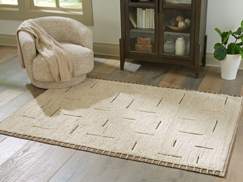 Beige rectangular rug with abstract line pattern and short, flat woven pile