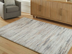 Nace rug with distressed cream and gray lines, visible texture and pile