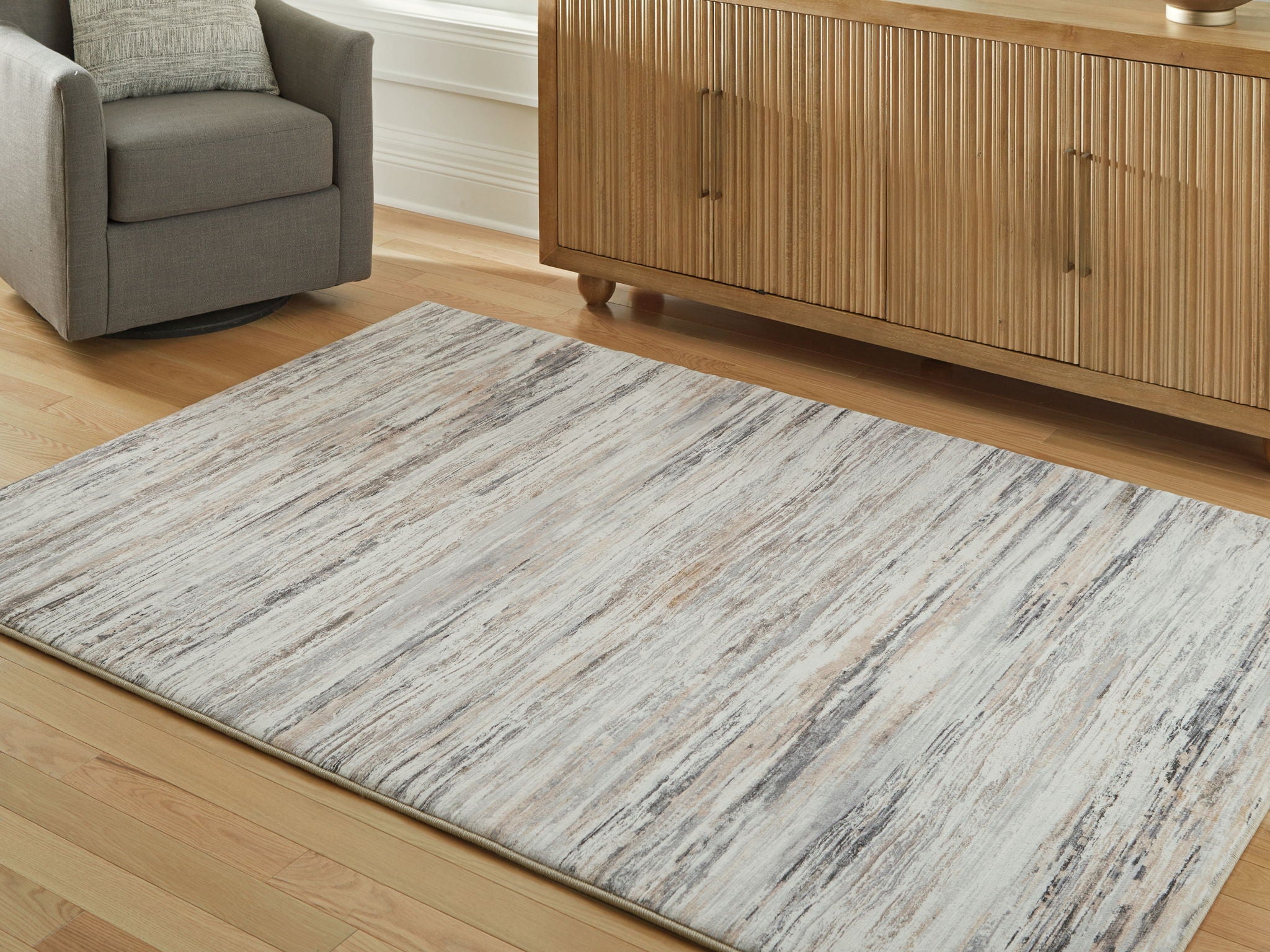 Nace rug with distressed cream and gray lines, visible texture and pile