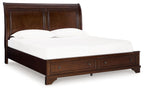 Brown king storage bed frame with paneled headboard and two drawers at the foot