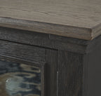 Dark cabinet door trim and wood grain detail on TV stand