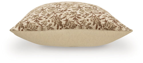 Throw pillow with brown botanical print on beige front and solid beige back