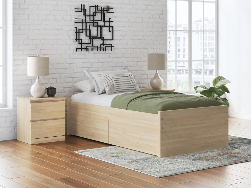 Light wood platform bed with open slat base and built-in side drawers