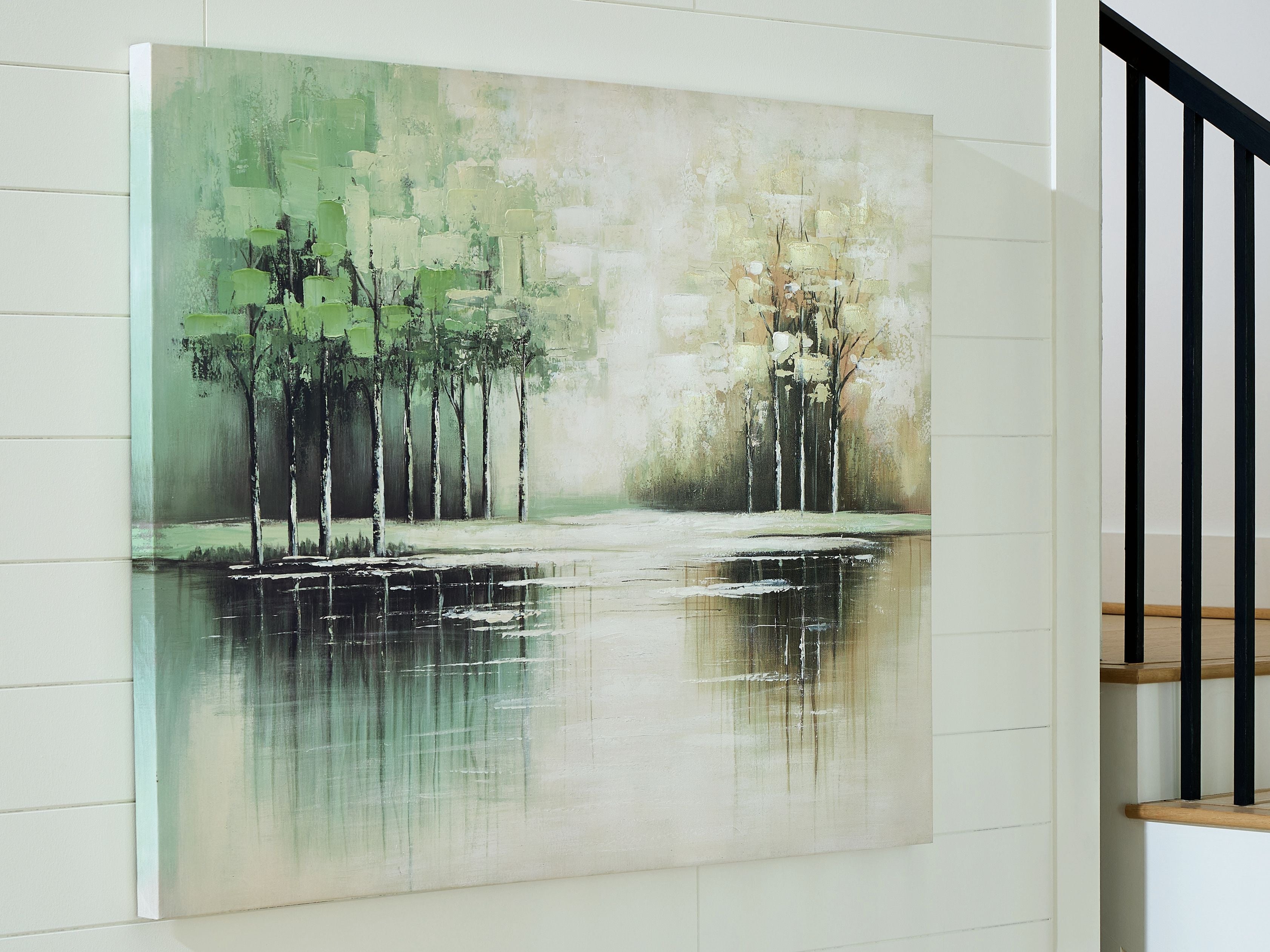 Abstract wall art canvas on wall with green-tan tree silhouettes and reflective water