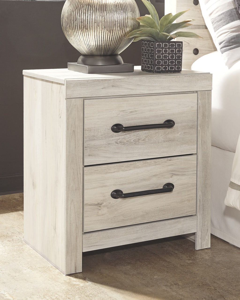 Whitewash two-drawer night stand with dark metal bar pulls and simple legs