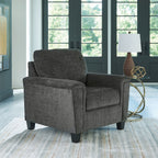 Dark gray upholstered armchair with high backrest and wide cushioned seat