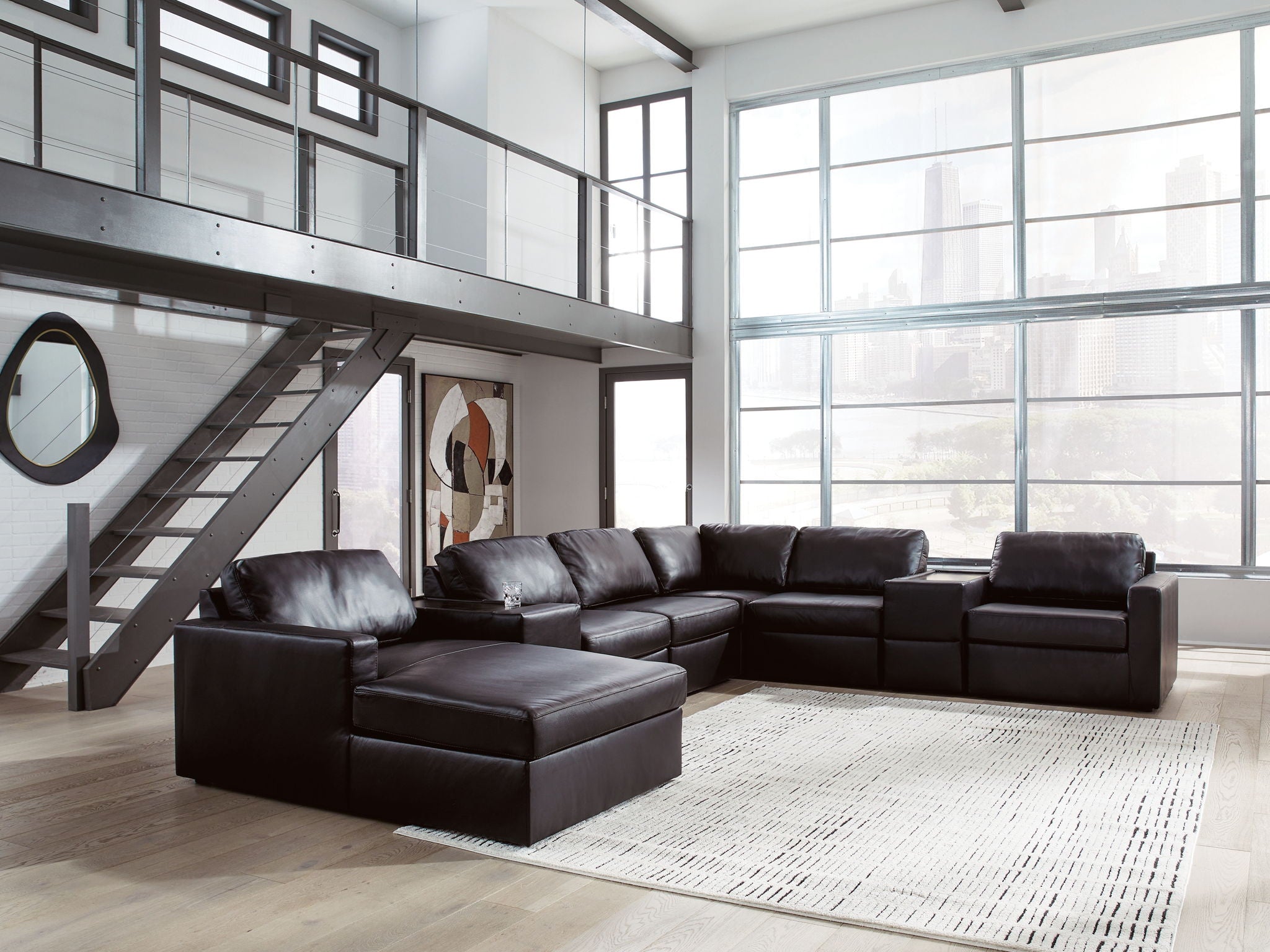 Black sectional sofa with chaise and low ottoman-style seat sections