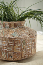Textured ceramic vase with raised geometric pattern, teal inlays, brown with small front opening.