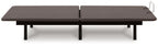 Adjustable bed base with dark two-section mattress platform and black legs, front view