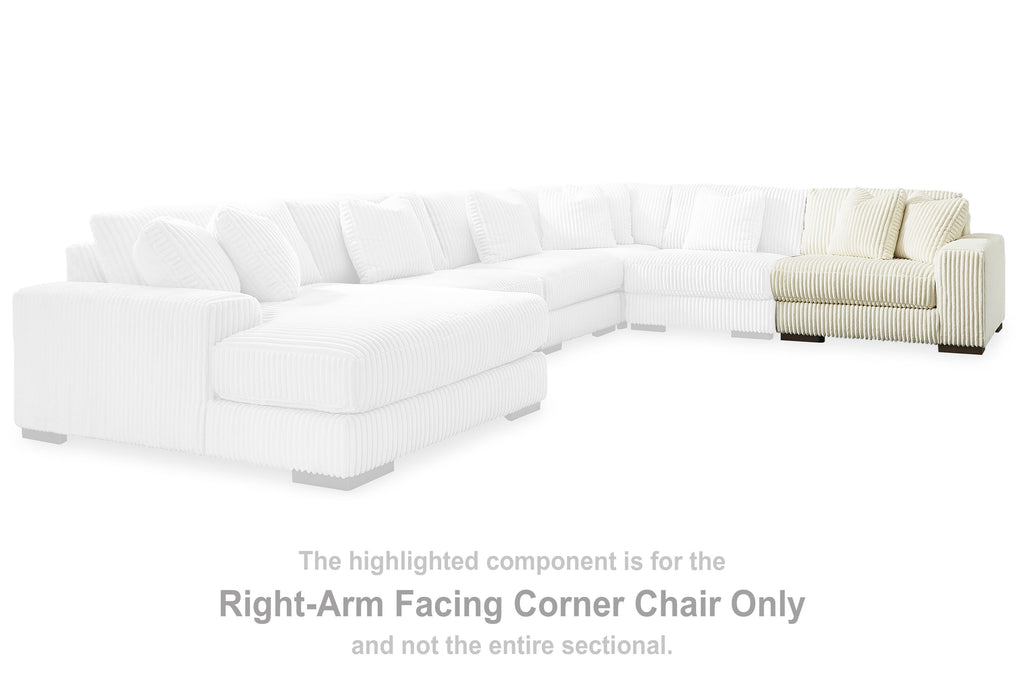Ivory sectional corner chair section with ribbed upholstery and right-facing arm