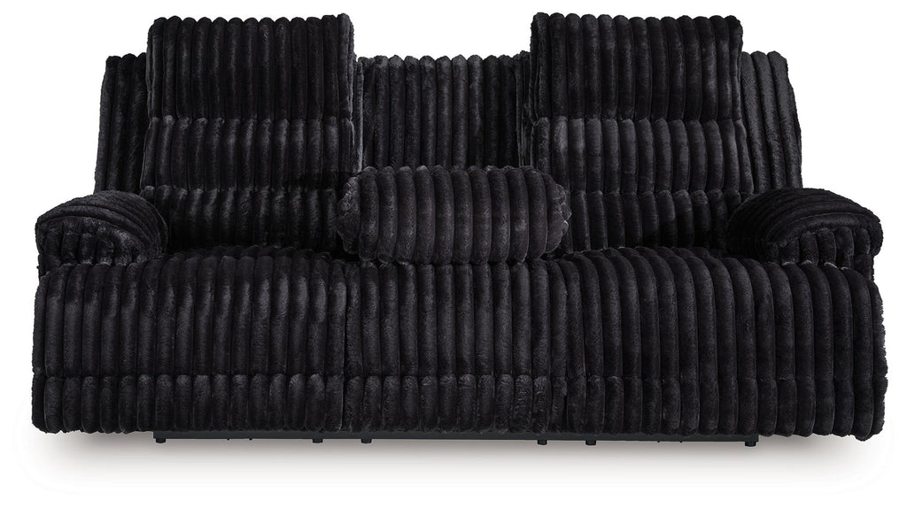 Black corduroy reclining sofa with plush backrest and padded armrests