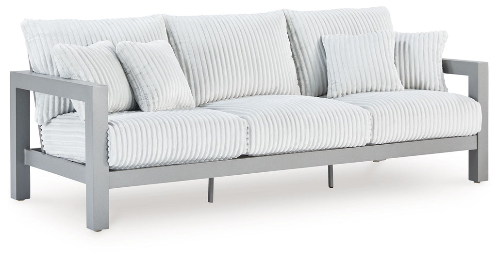 Hurley Park light gray outdoor sofa with armrests, ribbed seat cushions, and pillows