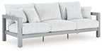 Hurley Park light gray outdoor sofa with armrests, ribbed seat cushions, and pillows