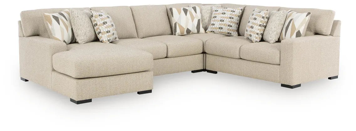 Laurelgrove L-shaped sectional sofa in pebble fabric with corner seam and decorative pillows