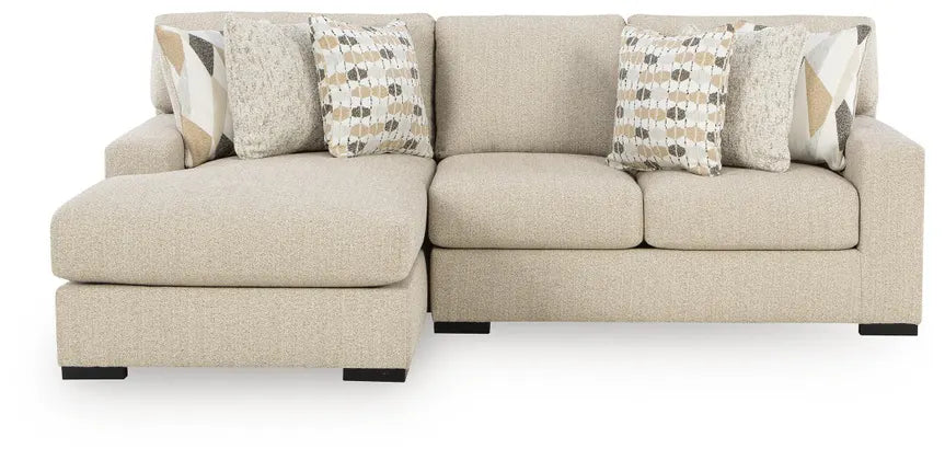 Laurelgrove sectional sofa in pebble fabric with patterned accent pillows and boxy arms