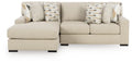 Laurelgrove sectional sofa in pebble fabric with patterned accent pillows and boxy arms