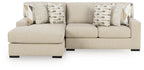 Laurelgrove sectional sofa in pebble fabric with patterned accent pillows and boxy arms