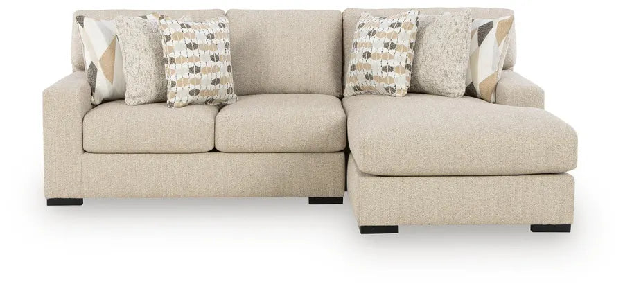 Laurelgrove sectional sofa in pebble fabric with two seat cushions and patterned throw pillows