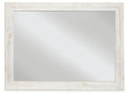 Rectangular bedroom accent mirror with whitewashed frame and reflective glass