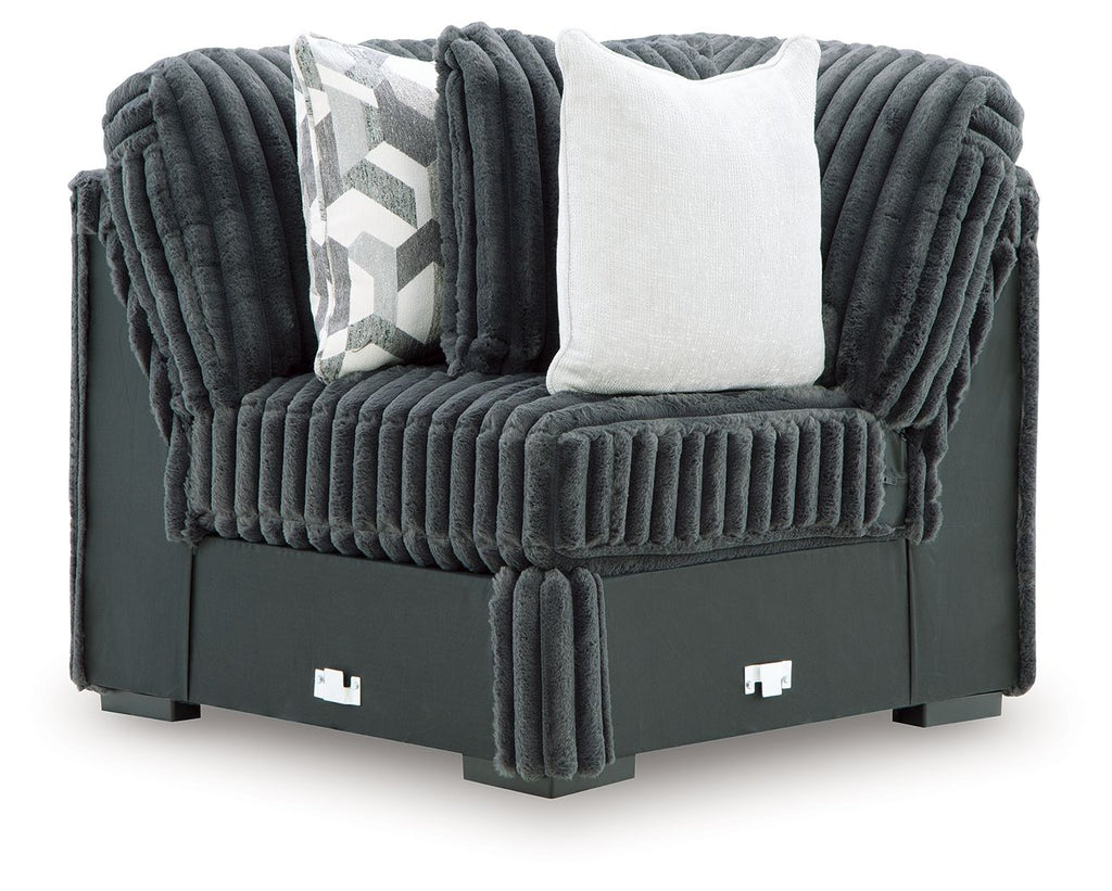Gunmetal corduroy-style wedge sofa with tufted cushions and two throw pillows