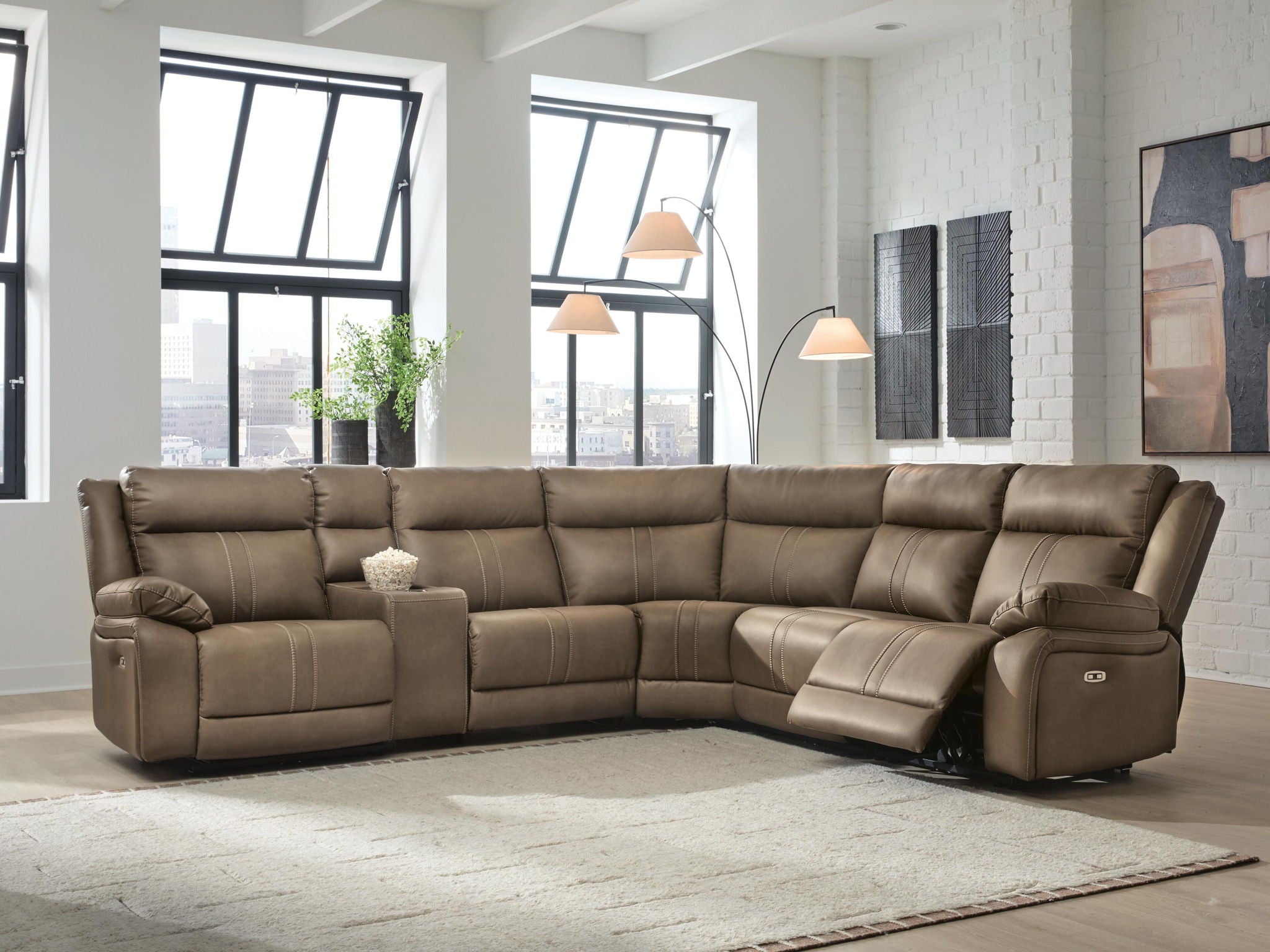 Taupe-brown power reclining sectional sofa with chaise corner and padded armrests