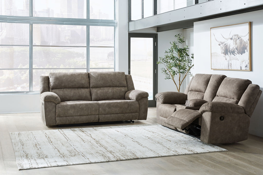 Reclining sofa and loveseat in dark brown fabric with tufted cushions