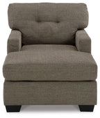 Dark brown upholstered chaise chair with tufted back, padded seat, and black feet