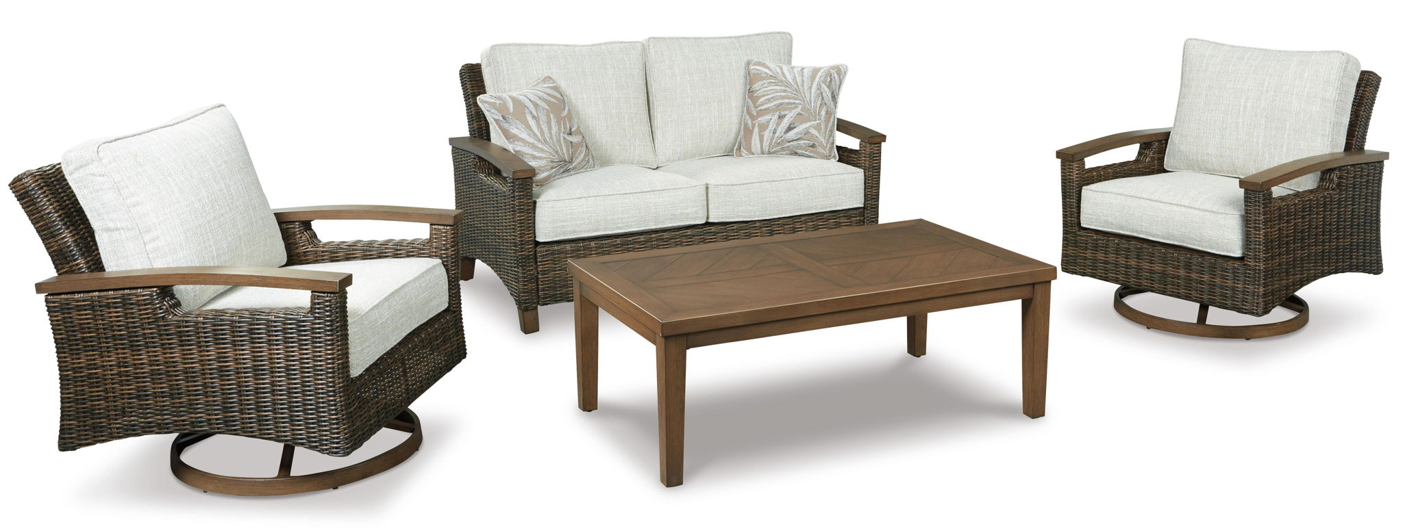 Brown wicker loveseat with cream cushions and two throw pillows