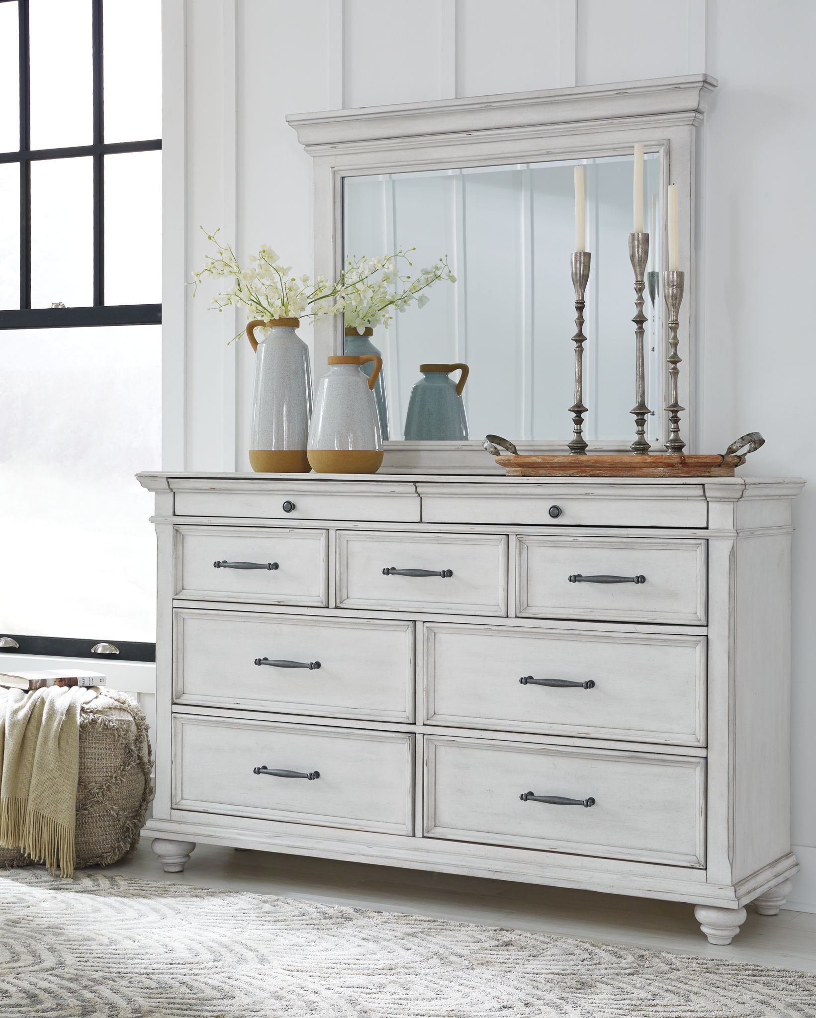 White dresser with mirror and drawer fronts, metal bar pulls