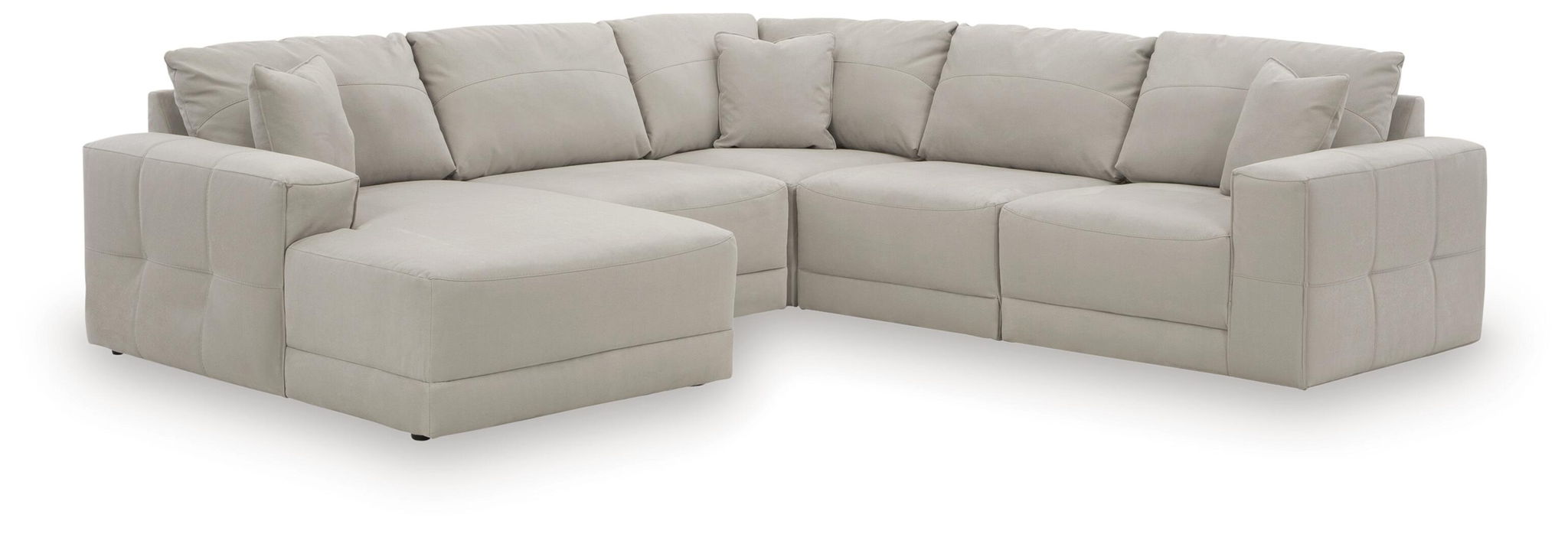 Light gray sectional sofa with left chaise, tufted back pillows and boxed seat cushions