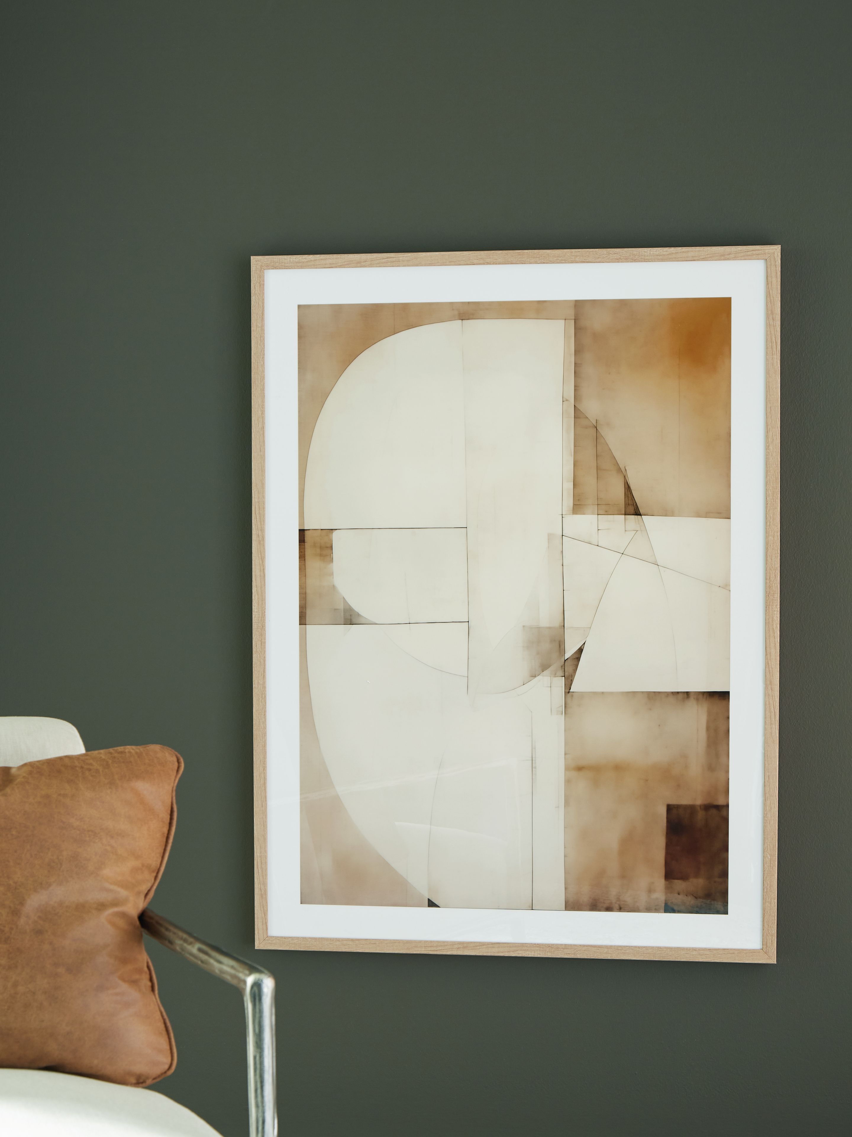 Framed abstract wall art print with layered white, tan, and brown geometric sections.