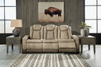 Sand power reclining sofa with high back, cushioned arms, and reclined seat cushions.