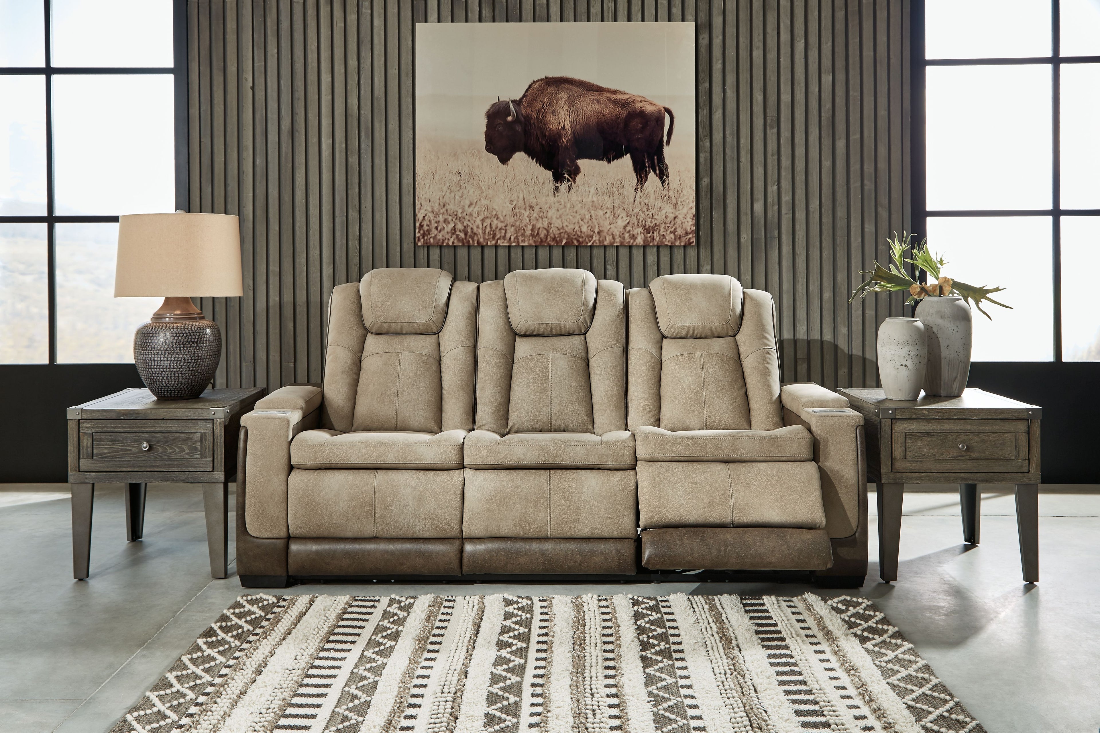 Sand power reclining sofa with high back, cushioned arms, and reclined seat cushions.