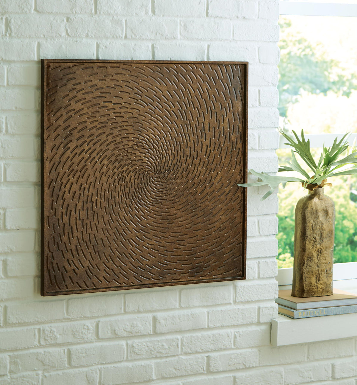Antique brown square wall art panel with embossed concentric spiral ripple relief, framed