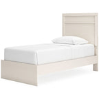Light wood panel bed with low footboard and tall headboard, white mattress