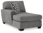 Gray corner chaise lounge with bolster back, ottoman-style chaise seat, black legs