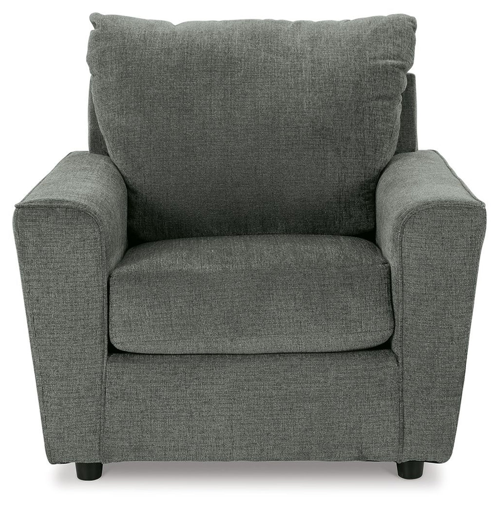 Gray upholstered armchair front view with padded arms, seat cushion, and tall back