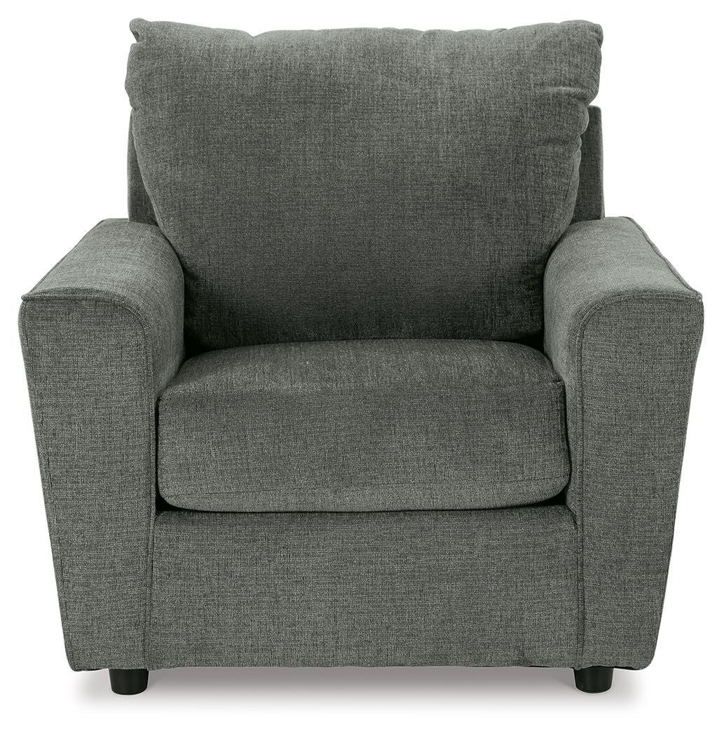 Gray upholstered armchair front view with padded arms, seat cushion, and tall back