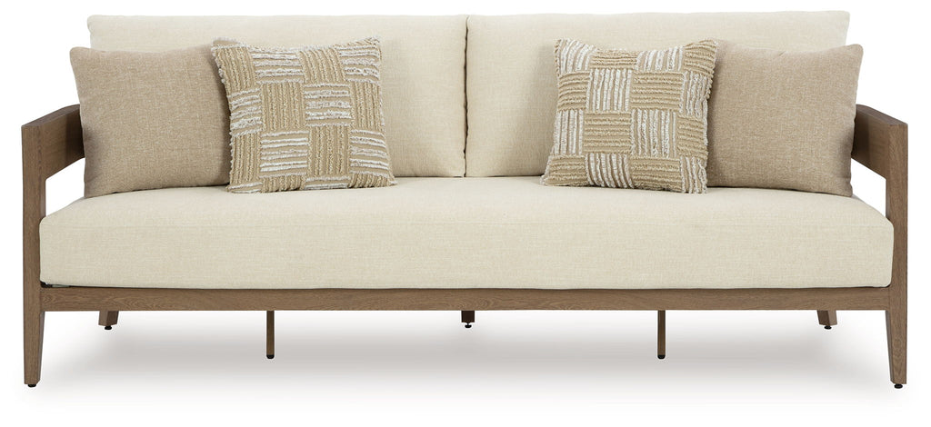 Outdoor lounge loveseat with beige cushions and two patterned pillows, straight back