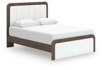 Upholstered bed with white upholstered headboard, padded sides, and dark wood frame