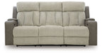 Power reclining sofa front view in light tan fabric with channel tufted back