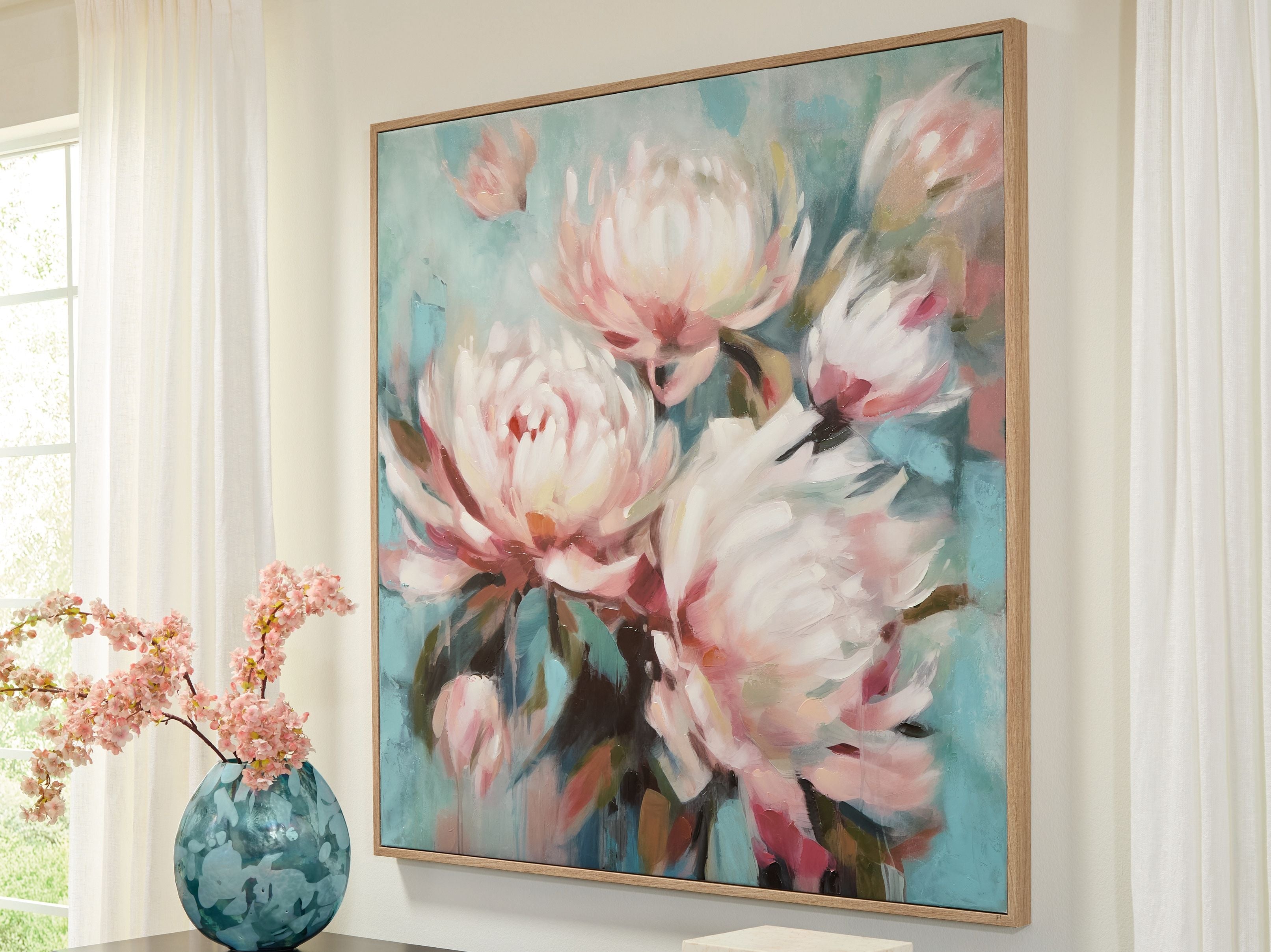 Framed floral wall art with white and pink blossoms on aqua teal, wall mounted