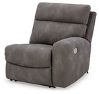 Slate gray fabric power recliner with padded headrest and armrests, front view.