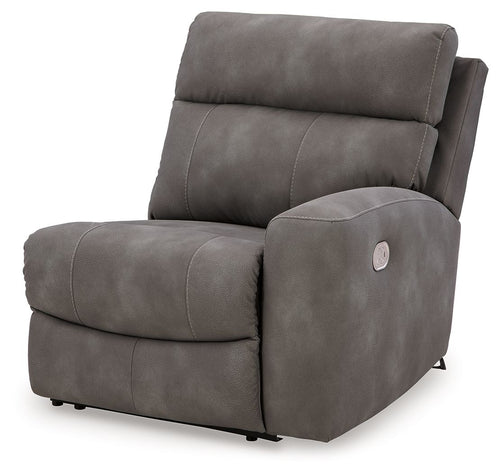 Slate gray fabric power recliner with padded headrest and armrests, front view.