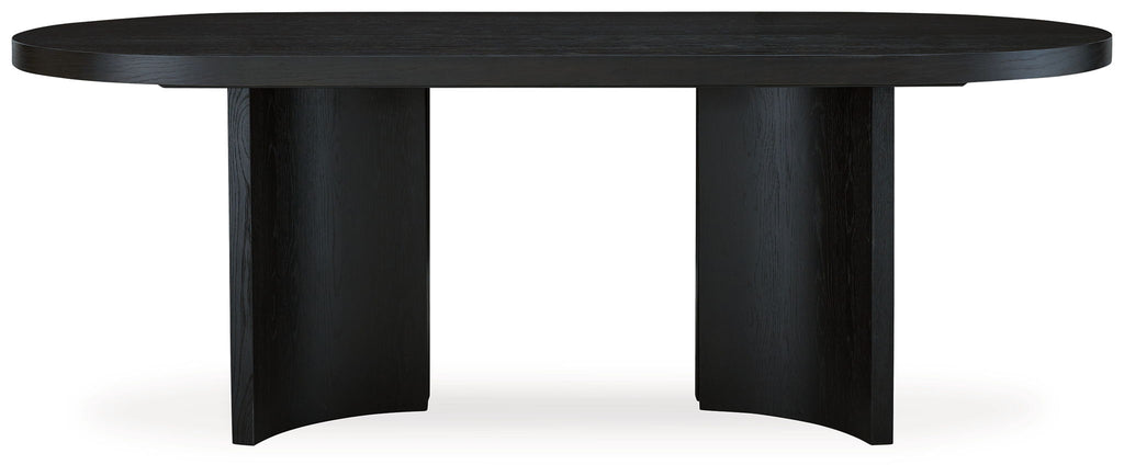 Black dining table with flared legs and round tabletop