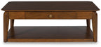 Rectangular cocktail table with single center drawer and lower shelf in medium brown wood