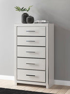 White five-drawer chest with silver bar pulls on five stacked drawers
