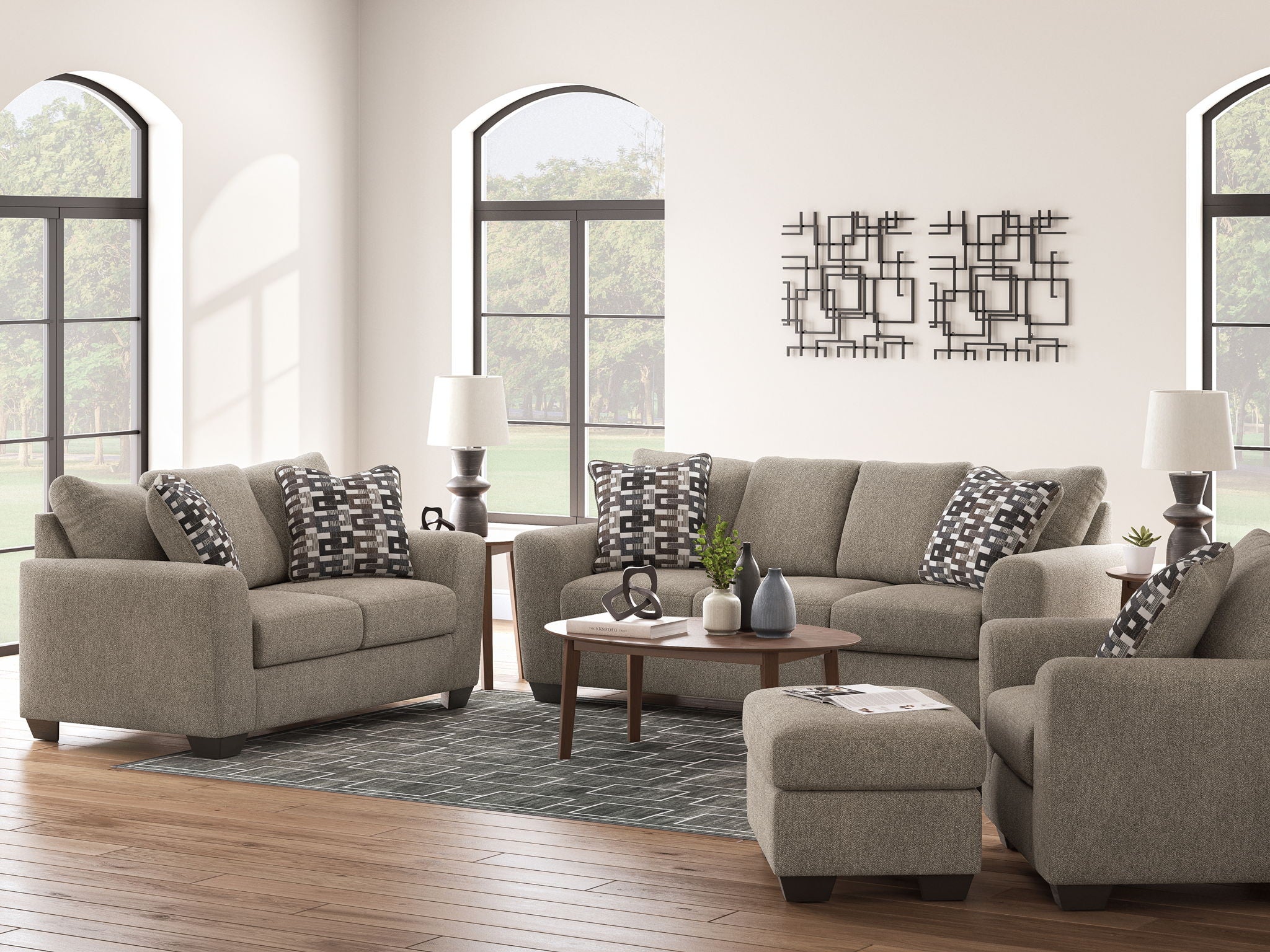 Beige fabric seating set with sofa, armchair, and geometric black-and-white throw pillows