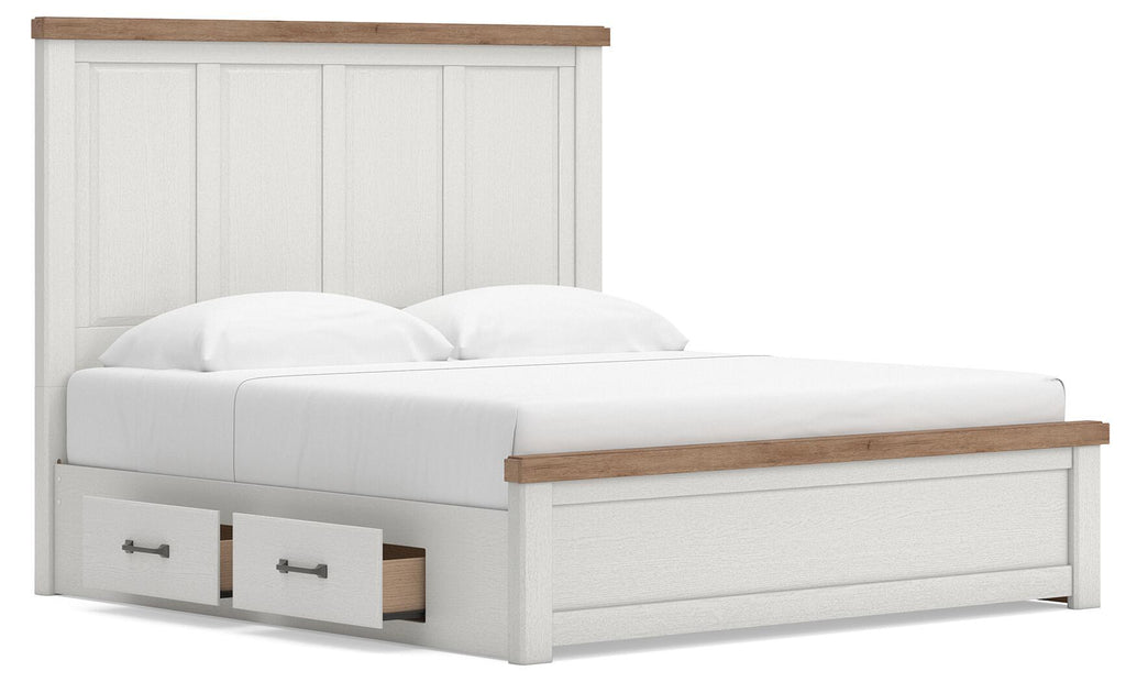 White panel storage bed with two front drawer compartments, paneled headboard